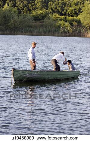 Stock Photo - businessman helping man overboard. Fotosearch