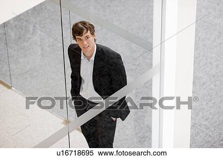Stock Photography - businessman looking toward camera. Fotosearch