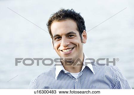 businessman on lakefront View Large Photo Image Stock Image - businessman on lakefront. Fotosearch