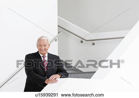 businessman on staircase View Large Photo Image Stock Image - businessman on staircase. Fotosearch