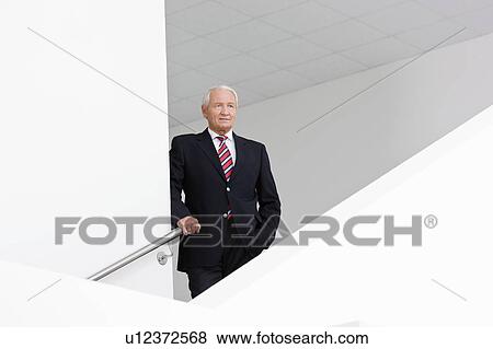 businessman on staircase View Large Photo Image Stock Photo - businessman on staircase. Fotosearch