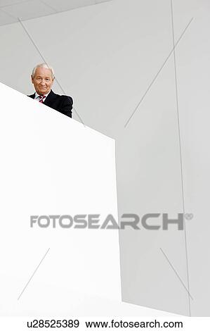 Stock Photo - businessman on staircase. Fotosearch