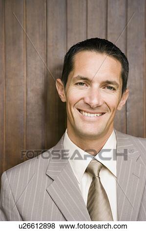 Stock Photo - businessman portrait smiling. Fotosearch