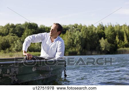businessman relaxing in rowboat View Large Photo Image Stock Photo - businessman relaxing in rowboat. Fotosearch