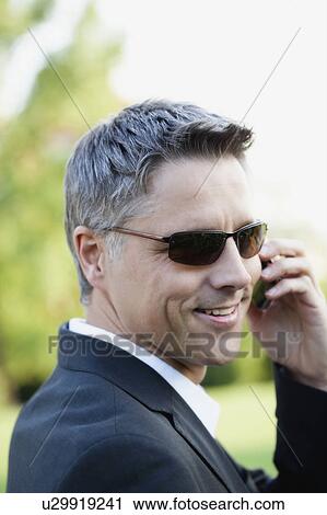 Stock Image - Businessman Using Cellphone. Fotosearch