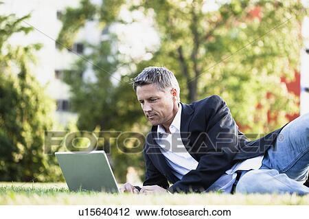 Businessman Using Laptop View Large Photo Image Stock Image - Businessman Using Laptop. Fotosearch