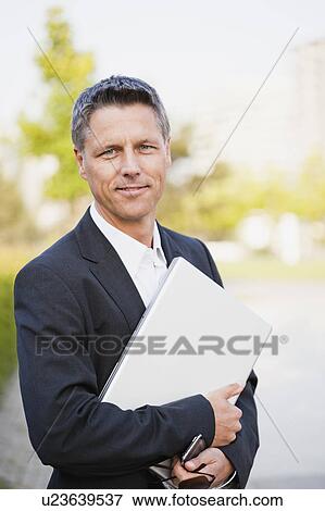 Stock Photo - Businessman With Laptop. Fotosearch