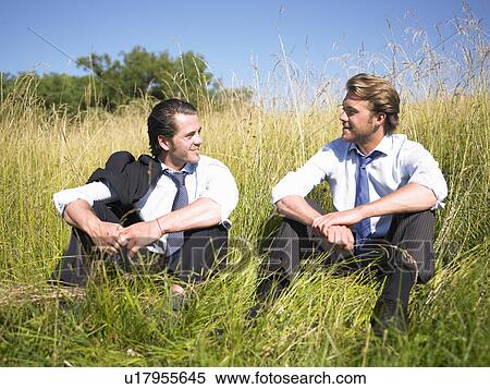 Stock Photography - businessmen in field of grasses. Fotosearch