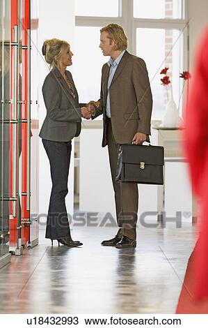 businesswoman & businessman shake hands View Large Photo Image Stock Image - businesswoman & businessman shake hands. Fotosearch