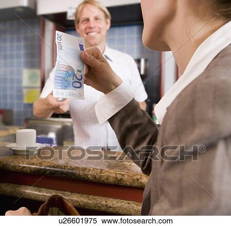businesswoman paying barkeeper in bar View Large Photo Image Stock Photography - businesswoman paying barkeeper in bar. Fotosearch