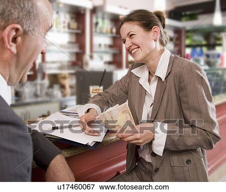 businesswoman paying man in bar View Large Photo Image Stock Photo - businesswoman paying man in bar. Fotosearch