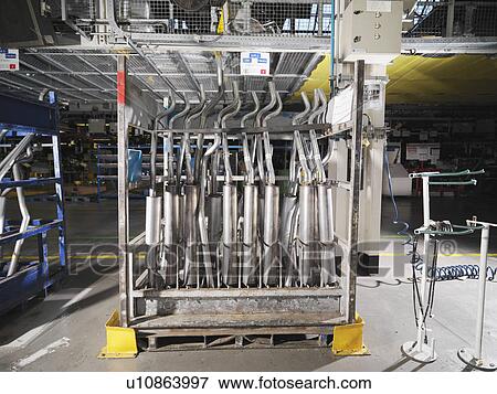 Stock Photo - Car Exhausts In Car Plant. Fotosearch