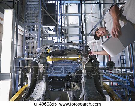 Car Plant Worker & Car From Below View Large Photo Image Stock Photography - Car Plant Worker & Car From Below. Fotosearch