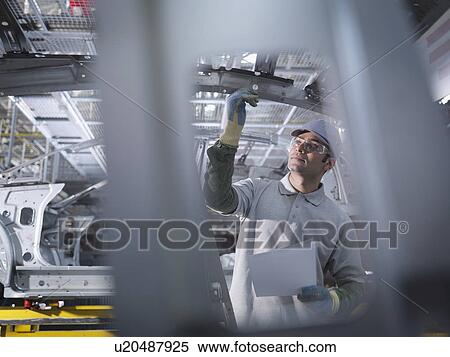 Car Plant Worker Inspecting Car View Large Photo Image Stock Photography - Car Plant Worker Inspecting Car. Fotosearch