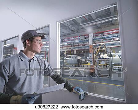 Car Plant Worker Looking Over Factory View Large Photo Image Stock Image - Car Plant Worker Looking Over Factory. Fotosearch