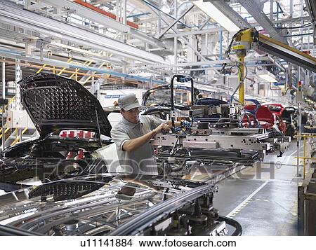 Car Plant Worker On Production Line View Large Photo Image Picture - Car Plant Worker On Production Line. Fotosearch