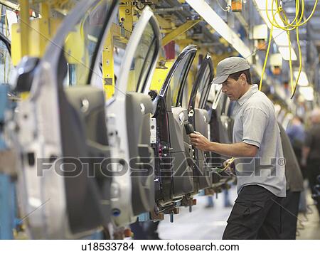 Picture - Car Plant Worker On Production Line. Fotosearch