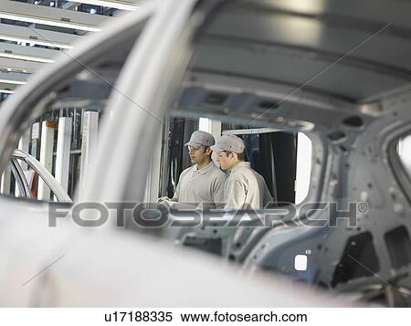 Car Plant Workers Discussing Work View Large Photo Image Stock Photography - Car Plant Workers Discussing Work. Fotosearch