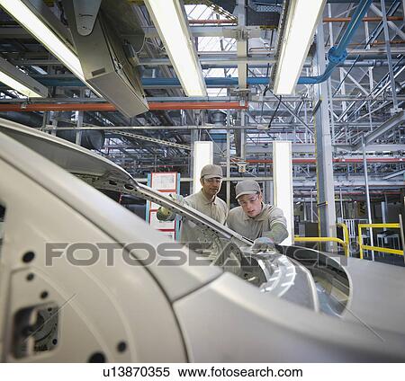 Stock Photography - Car Plant Workers Inspecting Work. Fotosearch