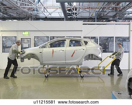 Car Plant Workers Moving Shell Of Car View Large Photo Image Stock Image - Car Plant Workers Moving Shell Of Car. Fotosearch