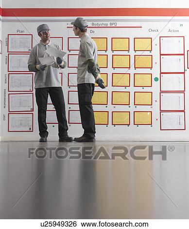 Car Plant Workers With Plans View Large Photo Image Stock Photograph - Car Plant Workers With Plans. Fotosearch