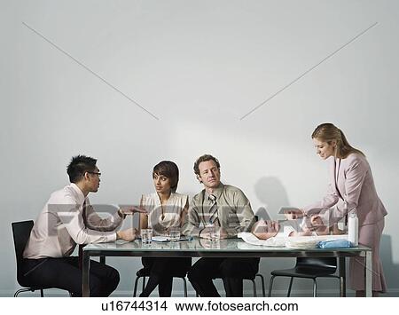 Picture - Changing baby's nappy in a meeting. Fotosearch