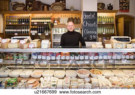 cheese, wine store owner in shop View Large Photo Image Stock Photo - cheese, wine store owner in shop. Fotosearch