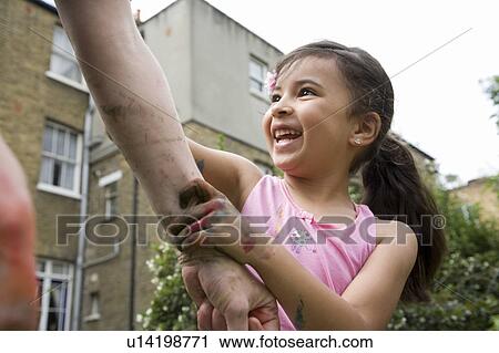 Stock Image - Child & Adult messy play. Fotosearch