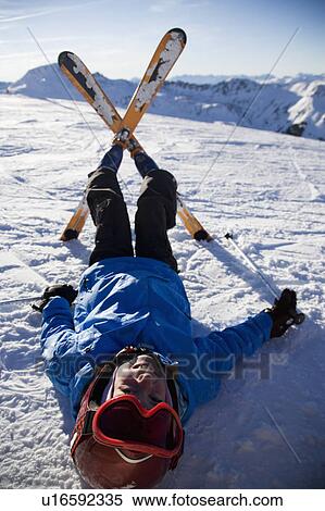 Child on skis lying in the snow. View Large Photo Image Stock Photography - Child on skis lying in the snow.. Fotosearch
