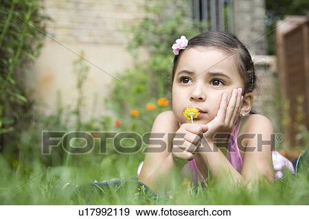 Child with flower View Large Photo Image Stock Photo - Child with flower. Fotosearch