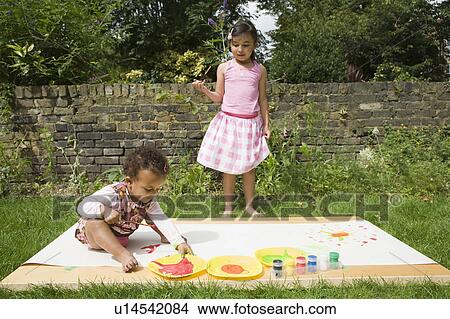 Picture - Children Painting in the garden. Fotosearch