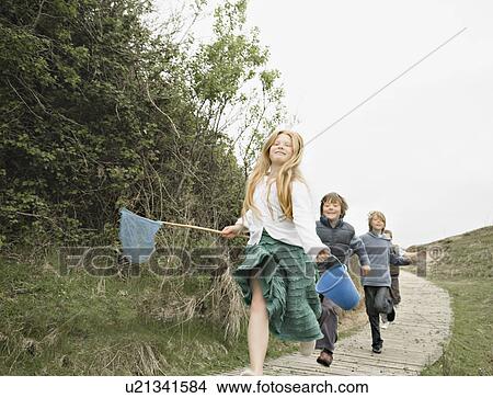 Children running along decking View Large Photo Image Picture - Children running along decking. Fotosearch