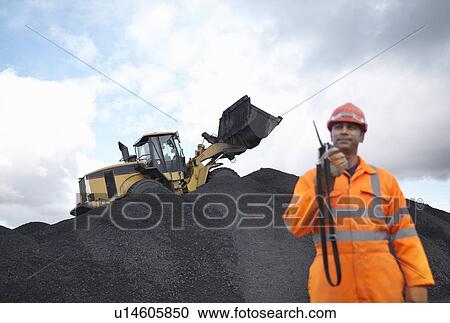 Coal Miner With Digger On Pile Of Coal View Large Photo Image Stock Image - Coal Miner With Digger On Pile Of Coal. Fotosearch