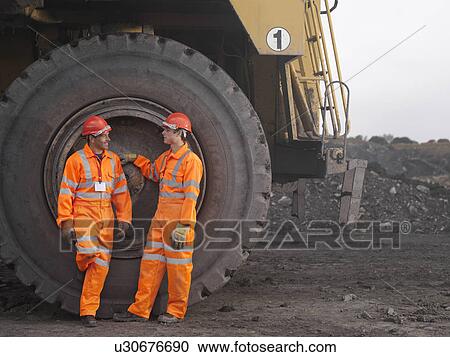 Stock Image - Coal Miners With Digger. Fotosearch