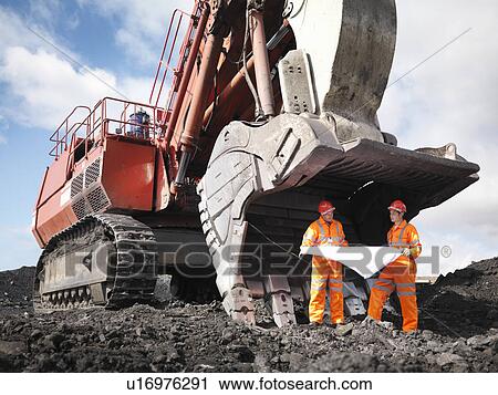 Stock Image - Coal Miners With Plans And Digger. Fotosearch