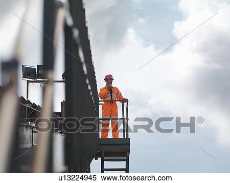 Stock Photography - Coal Worker On Viewing Platform. Fotosearch