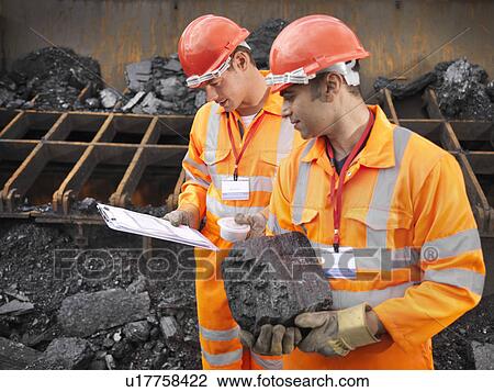 Stock Image - Coal Workers Inspecting Coal. Fotosearch