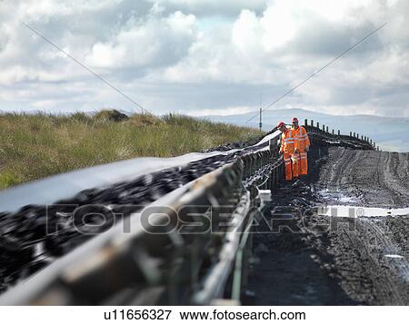 Coal Workers Inspecting Conveyor Belt View Large Photo Image Stock Photo - Coal Workers Inspecting Conveyor Belt. Fotosearch