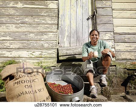 Stock Image - Coffee Worker With Cup Of Coffee. Fotosearch