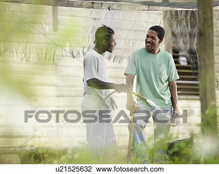 Coffee Workers Watering Plants View Large Photo Image Stock Image - Coffee Workers Watering Plants. Fotosearch