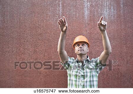 Stock Photo - Construction Worker Directing. Fotosearch