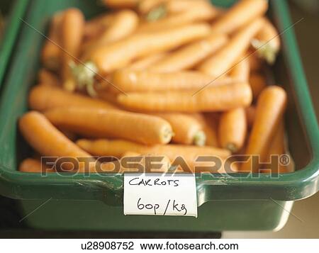 Stock Image - Container Of Carrots For Sale. Fotosearch