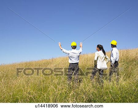 Stock Photograph - contractors in field. Fotosearch