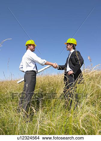 contractors with blueprints in field View Large Photo Image Picture - contractors with blueprints in field. Fotosearch