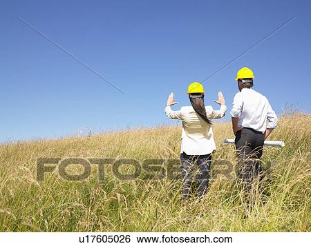 contractors with blueprints in field View Large Photo Image Stock Photograph - contractors with blueprints in field. Fotosearch