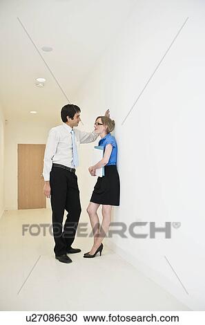 couple chatting in corridor View Large Photo Image Stock Image - couple chatting in corridor. Fotosearch