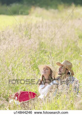 couple in hats eyes closed, relaxed View Large Photo Image Stock Photograph - couple in hats eyes closed, relaxed. Fotosearch