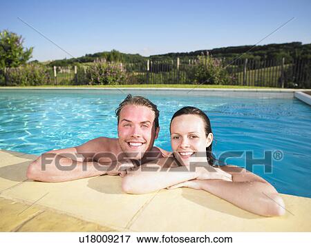 Stock Photo - couple in pool. Fotosearch