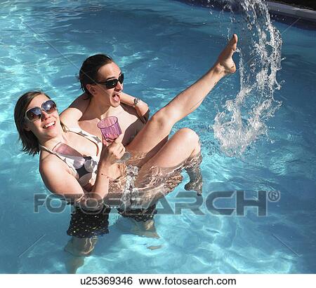 couple in pool View Large Photo Image Stock Photograph - couple in pool. Fotosearch