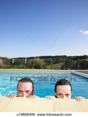 Stock Photography - couple in pool. Fotosearch